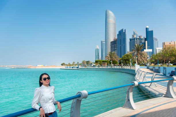 Families relaxing at the luxurious beachfront of Abu Dhabi, a top choice for expat living