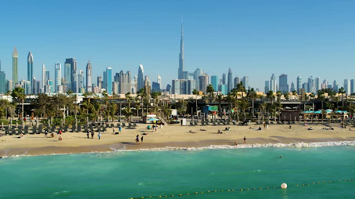 A vibrant beach in a city with numerous skyscrapers, illustrating the unique allure of ELO 3's picturesque appeal.