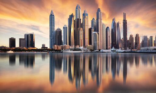 Dubai skyscrapers reflecting in a calm marina during a dramatic sunset, resembling ELO 3's dynamic uniqueness.